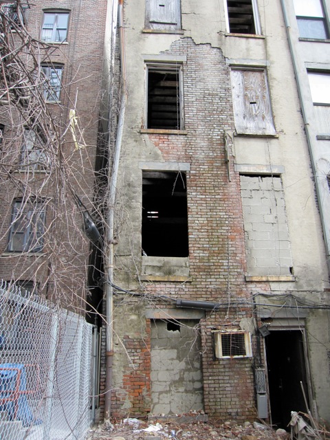 dilapidated rear wall on harlem townhouse shell