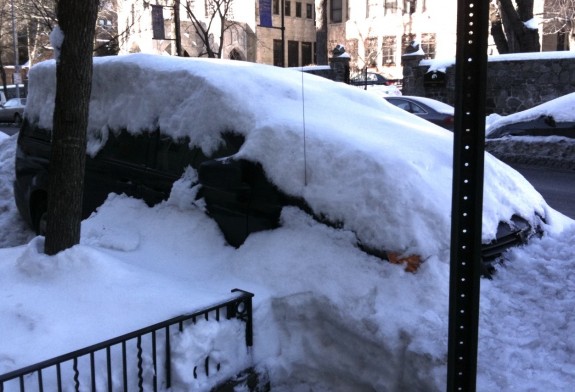 Minivan covered by snowbank in NYC