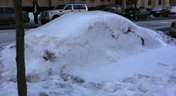 Snowbank covers car in New York City