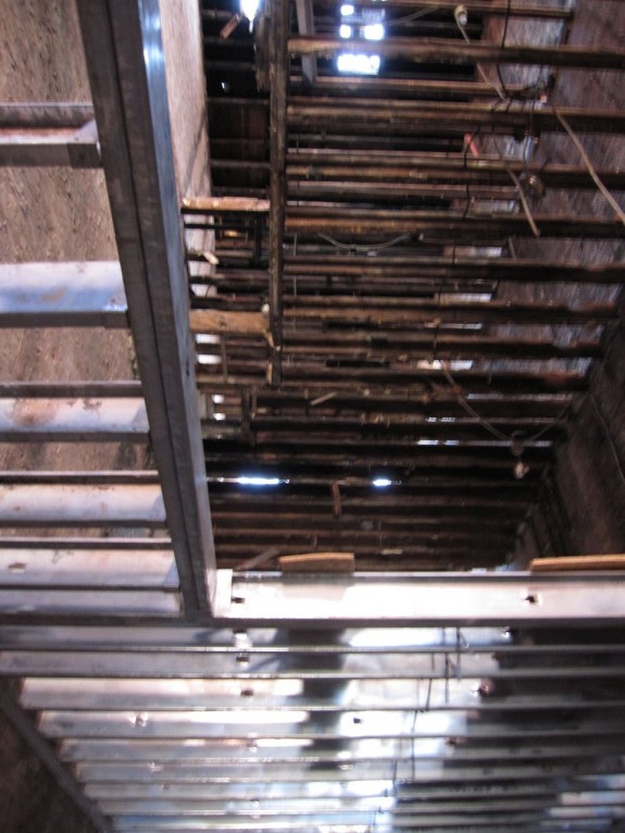 New metal floor joists and rotting old wooden joists