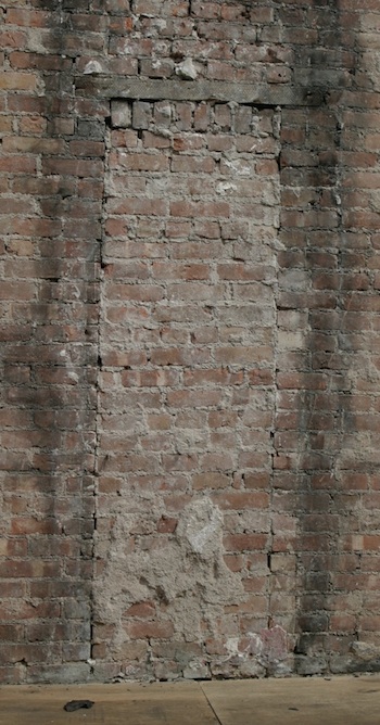 Bricked up doorway for workmen in Harlem townhouse