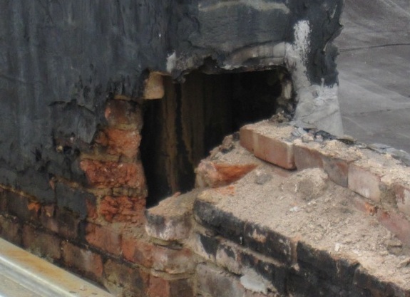 hole in brick chimney