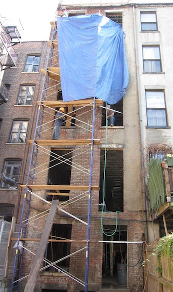 Cleaning and repointing brick on Harlem townhouse