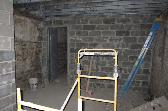 Concrete block wall between storage area and mechanical room