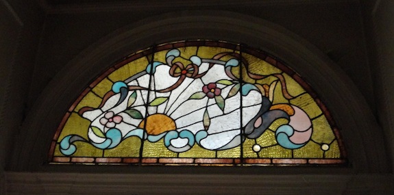 Stained glass window over entry in Harlem townhouse