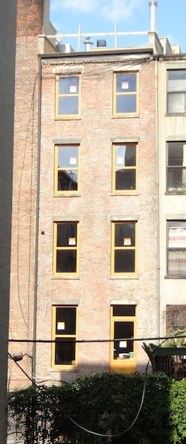 back of renovated townhouse in bright light