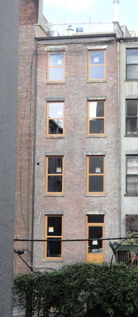 back of renovated townhouse in dim light