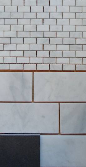 Carrara subway tile and mini bricks for master bathroom